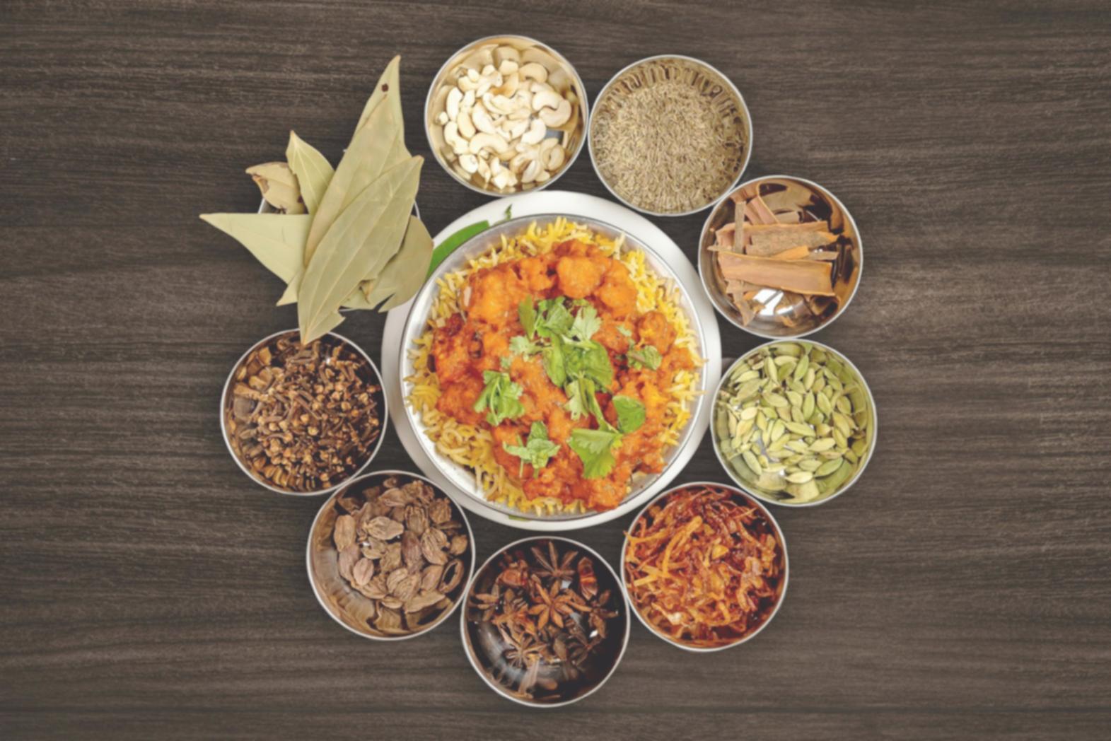 Students learning traditional cooking techniques in small group setting